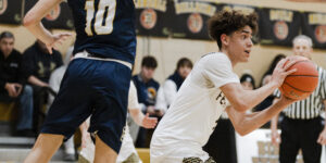 Lynnfield's Gavin Deluties guards Fenwick's Nate Allder.